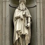 Full body statue in stone of Leonardo da Vinci