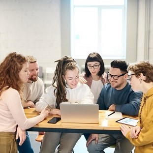 6 co-workers at an elevated office workstation