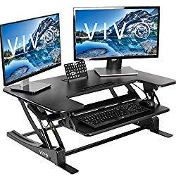 Black desk converter with dual monitors and tablet on upper tier