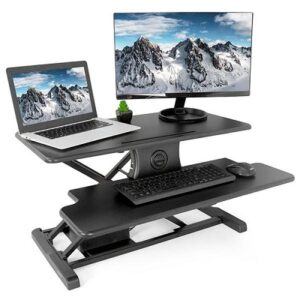 The VIVO 2 tier standing desk converter supporting a monitor, laptop, keyboard and mouse