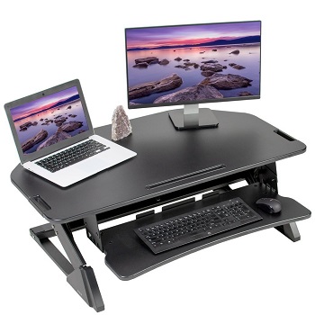 monitor, laptop, mouse and keyboard set up on a z frame standing desk converter