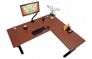 L shaped Lander standing desk set up with keyboard and monitor