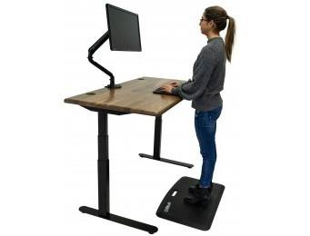 Woman working at the Lander standing desk with a solid wood top