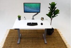 ZipDesk with white desktop and silver legs supporting a keyboard and monitor