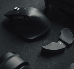 Black ergonomic mouse against a dark grey background