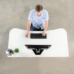 View from above of man sitting at the white vivo 63 inch electric standing desk