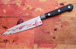 Chopping block with beets-stained knife