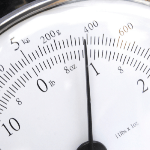 Weighing scales showing measurements in pounds, ounces and kilograms