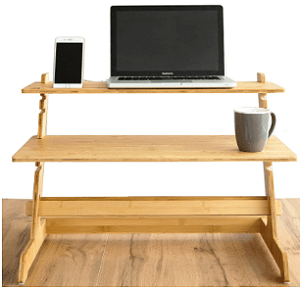 A wooden 2 tier desk converter with laptop and smartphone.