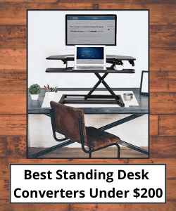 Standing desk converter in raised position supporting office equipment with title text underneath reading "Best Standing Desk Converters Under $200"